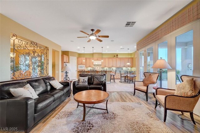 212 Florio Ct, Las Vegas, NV 89138 - living room with a ceiling fan and light wood finished floors
