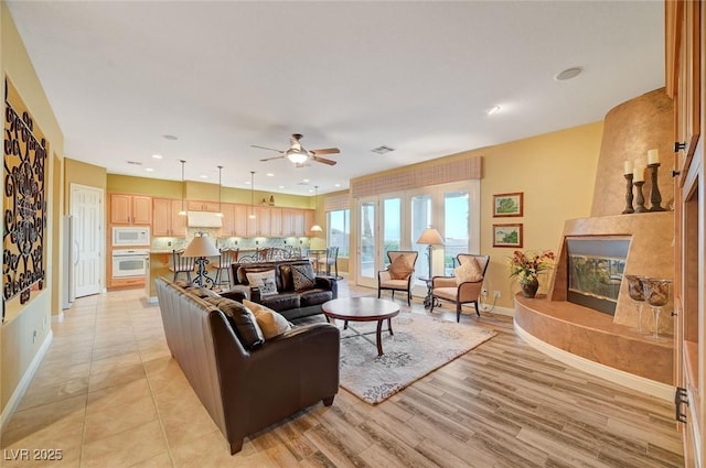212 Florio Ct, Las Vegas, NV 89138 - living area with a ceiling fan, light wood-type flooring, a fireplace, and recessed lighting