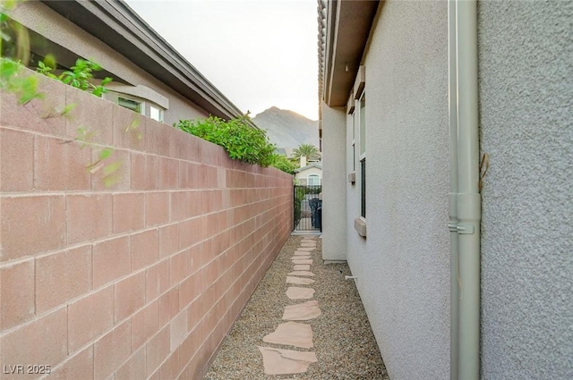 212 Florio Ct, Las Vegas, NV 89138 - view of side of home featuring stucco siding and a gate