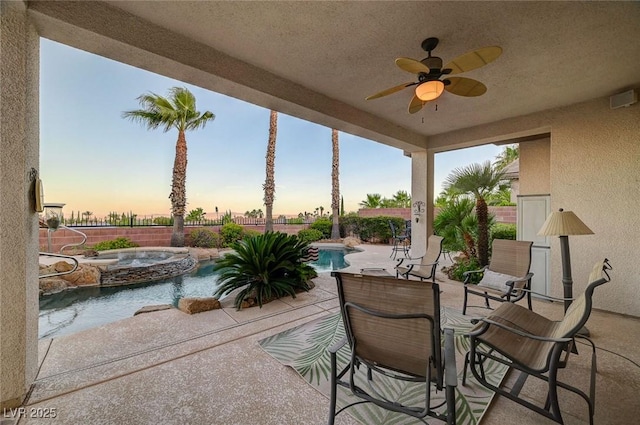 212 Florio Ct, Las Vegas, NV 89138 - patio terrace at dusk featuring an in-ground hot tub, a ceiling fan, a patio, and a fenced backyard