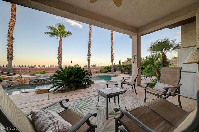 212 Florio Ct, Las Vegas, NV 89138 - fenced backyard with a ceiling fan and a patio area