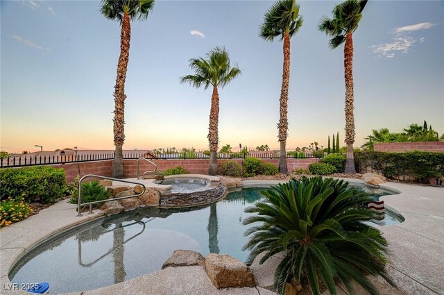 212 Florio Ct, Las Vegas, NV 89138 - pool at dusk with a pool with connected hot tub