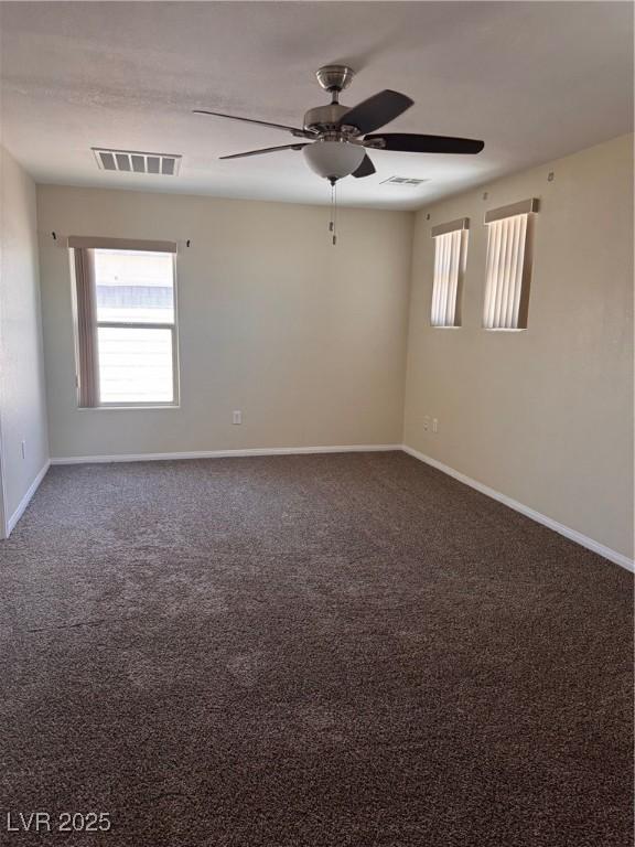 32 Yellow Peak Ave, North Las Vegas, NV 89031 - spare room featuring a ceiling fan and carpet flooring