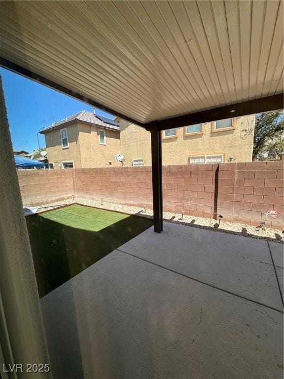 32 Yellow Peak Ave, North Las Vegas, NV 89031 - fenced backyard with a patio area
