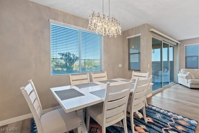 714 Rogue Wave St, Las Vegas, NV 89138 - dining area with a chandelier and wood finished floors