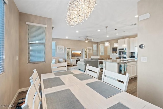714 Rogue Wave St, Las Vegas, NV 89138 - dining space featuring a chandelier, a ceiling fan, and recessed lighting