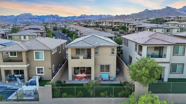 714 Rogue Wave St, Las Vegas, NV 89138 - back of house with a residential view, a fenced backyard, stucco siding, and a mountain view