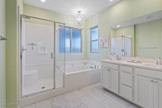 714 Rogue Wave St, Las Vegas, NV 89138 - bathroom with marble finish flooring, a stall shower, a garden tub, double vanity, and a chandelier