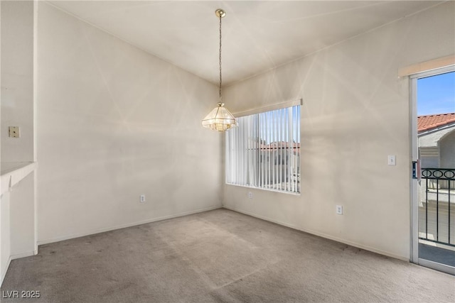 6201 E Lake Mead Blvd Unit 210, Las Vegas, NV 89156 - unfurnished dining area featuring carpet flooring and a chandelier