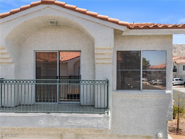 6201 E Lake Mead Blvd Unit 210, Las Vegas, NV 89156 - doorway to property with stucco siding and a tiled roof