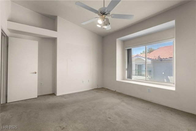 6201 E Lake Mead Blvd Unit 210, Las Vegas, NV 89156 - empty room with carpet flooring, vaulted ceiling, and ceiling fan