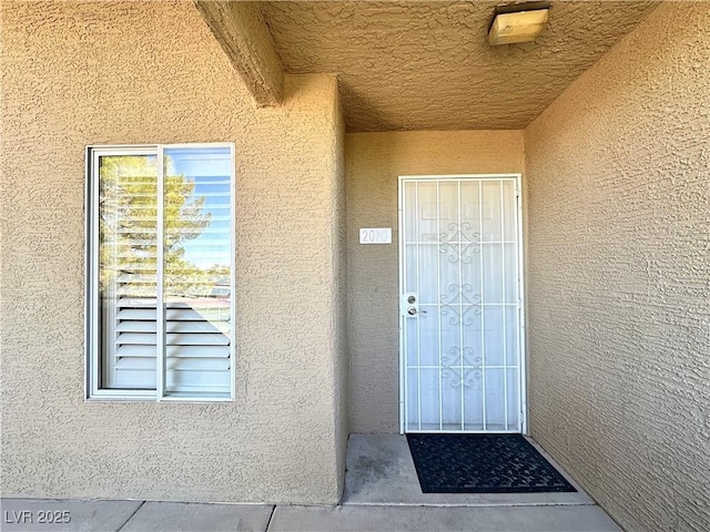 8070 W Russell Rd Unit 2070, Las Vegas, NV 89113 - view of exterior entry featuring stucco siding