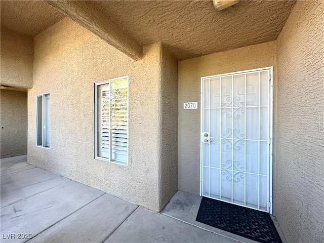 8070 W Russell Rd Unit 2070, Las Vegas, NV 89113 - view of exterior entry featuring stucco siding