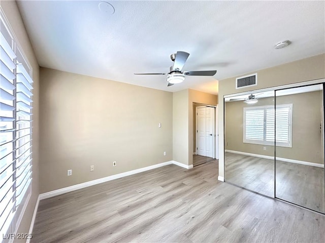 8070 W Russell Rd Unit 2070, Las Vegas, NV 89113 - unfurnished bedroom featuring wood finished floors and ceiling fan