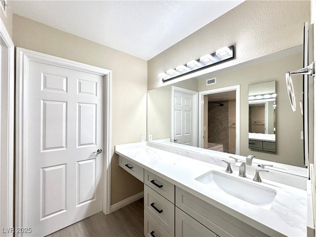 8070 W Russell Rd Unit 2070, Las Vegas, NV 89113 - full bathroom featuring wood finished floors and vanity