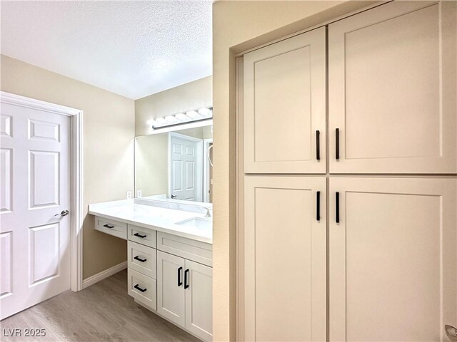 8070 W Russell Rd Unit 2070, Las Vegas, NV 89113 - bathroom with wood finished floors and vanity