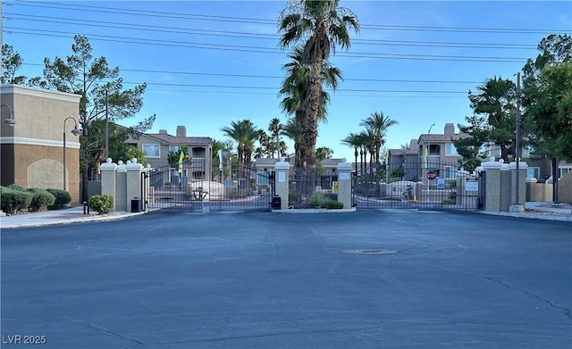 8070 W Russell Rd Unit 2070, Las Vegas, NV 89113 - view of asphalt street with a gate, a gated entry, and a residential view