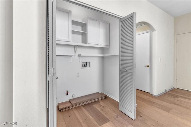 9948 Trailing Vine St, Las Vegas, NV 89183 - laundry room featuring washer hookup, light wood finished floors, gas dryer hookup, and arched walkways