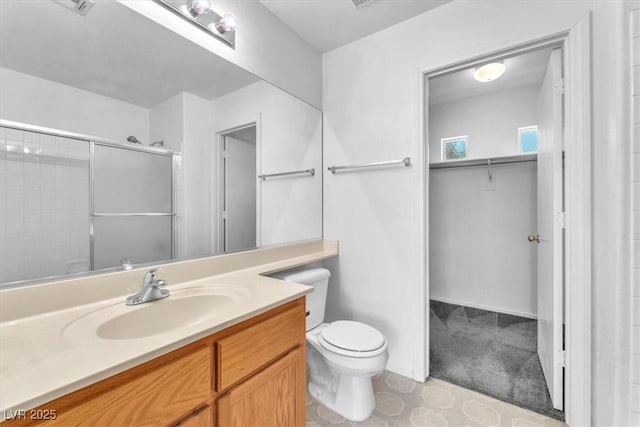 9948 Trailing Vine St, Las Vegas, NV 89183 - full bath featuring vanity, a shower with shower door, and a walk in closet