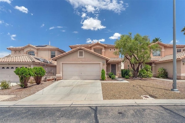 9948 Trailing Vine St, Las Vegas, NV 89183 - mediterranean / spanish-style home with a garage, stucco siding, and driveway