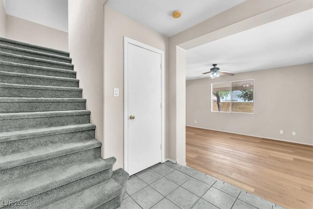 9948 Trailing Vine St, Las Vegas, NV 89183 - stairway with ceiling fan and tile patterned floors