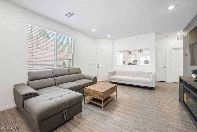 3447 Covilha Ln, Henderson, NV 89044 - living area featuring light wood-style flooring and recessed lighting