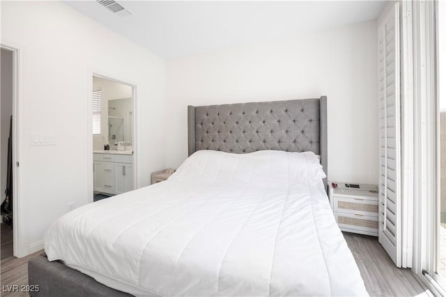 3447 Covilha Ln, Henderson, NV 89044 - bedroom featuring wood finished floors and ensuite bath