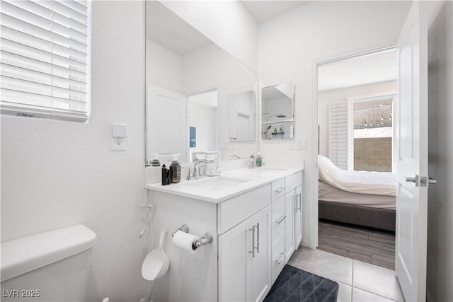 3447 Covilha Ln, Henderson, NV 89044 - full bath with tile patterned floors, double vanity, plenty of natural light, and connected bathroom