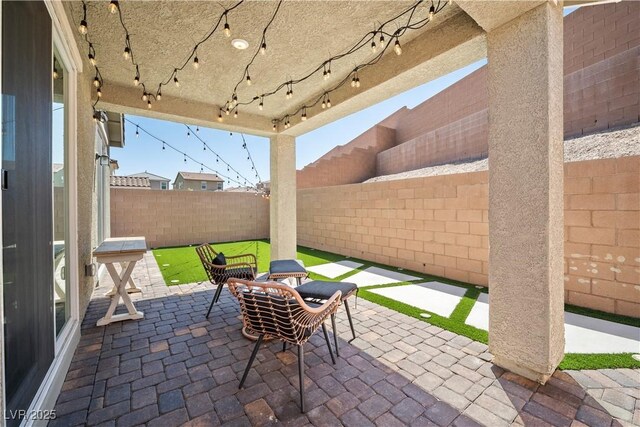 3447 Covilha Ln, Henderson, NV 89044 - fenced backyard with a patio