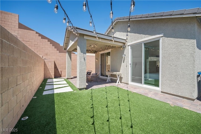 3447 Covilha Ln, Henderson, NV 89044 - back of house with stucco siding, a fenced backyard, and a patio