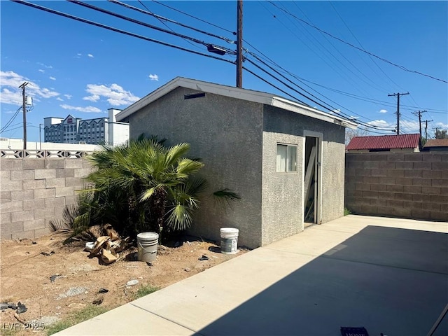 612 Brush St, Las Vegas, NV 89107 - view of side of property featuring stucco siding and a patio