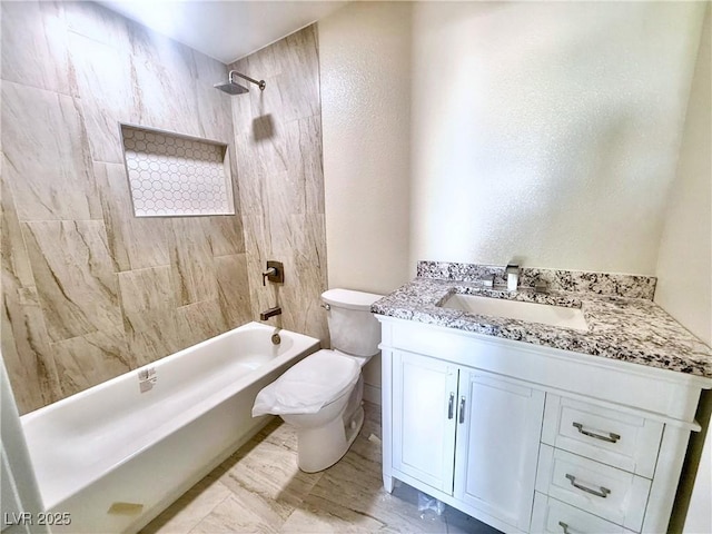 612 Brush St, Las Vegas, NV 89107 - bathroom featuring vanity, washtub / shower combination, a textured wall, and marble finish flooring