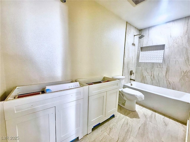 612 Brush St, Las Vegas, NV 89107 - full bath with a textured wall, shower / bathtub combination, and marble look tiles
