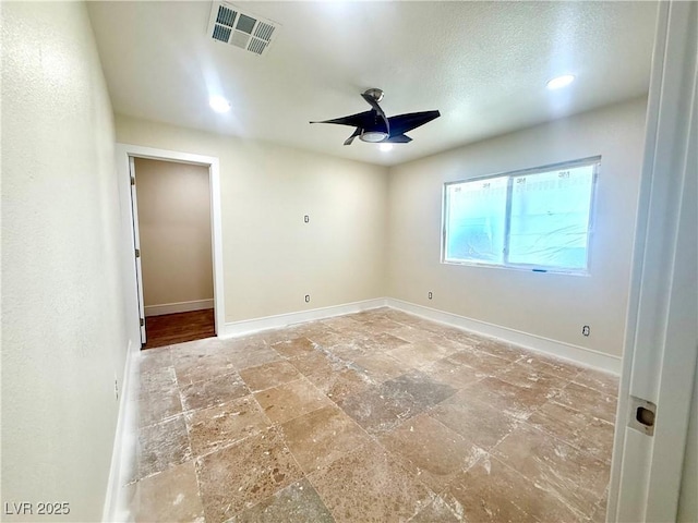 612 Brush St, Las Vegas, NV 89107 - unfurnished room featuring stone tile flooring and ceiling fan