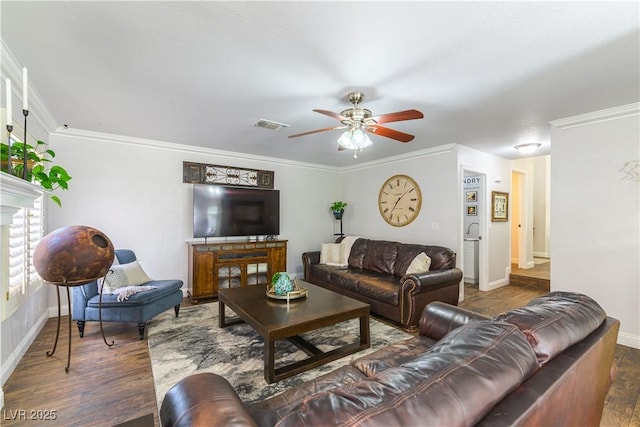 3024 Pier Harbor Dr, Las Vegas, NV 89117 - living area featuring wood finished floors, a ceiling fan, crown molding, and a fireplace with raised hearth