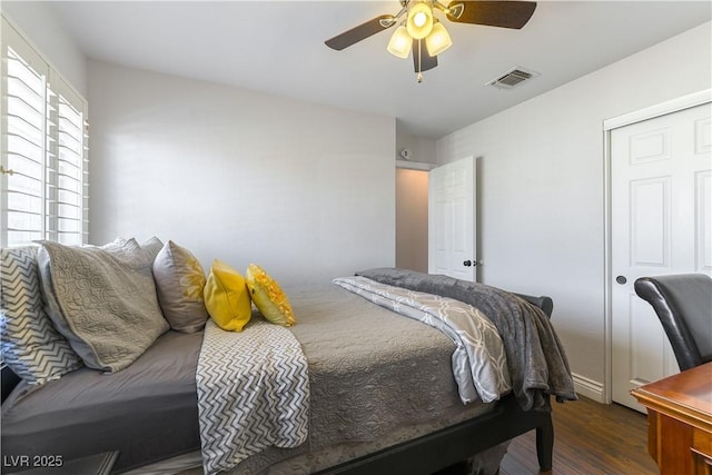 3024 Pier Harbor Dr, Las Vegas, NV 89117 - bedroom featuring dark wood-style flooring, ceiling fan, and a closet