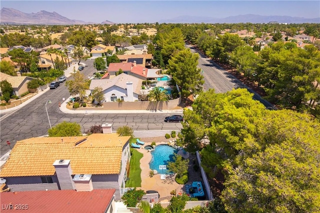 3024 Pier Harbor Dr, Las Vegas, NV 89117 - aerial perspective of suburban area with a pool and mountains