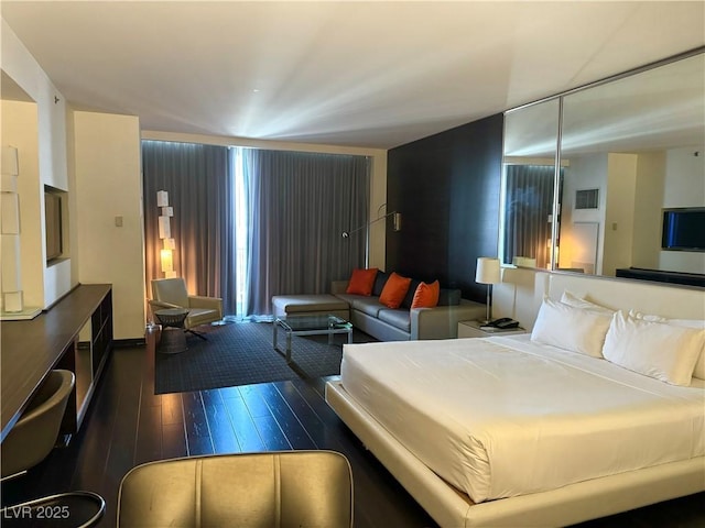 4381 W Flamingo Rd Unit 3708, Las Vegas, NV 89103 - bedroom featuring dark wood finished floors