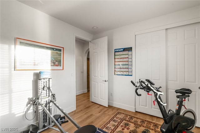 2310 Malaga Peak St, Las Vegas, NV 89135 - workout area with arched walkways and light wood finished floors