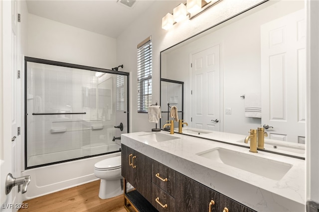 2310 Malaga Peak St, Las Vegas, NV 89135 - bathroom with wood finished floors, double vanity, and shower / bath combination with glass door