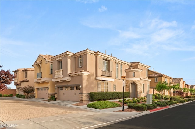 2310 Malaga Peak St, Las Vegas, NV 89135 - view of front of home featuring stone siding, a garage, a residential view, and driveway