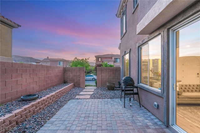 2310 Malaga Peak St, Las Vegas, NV 89135 - patio terrace at dusk featuring a gate and a patio