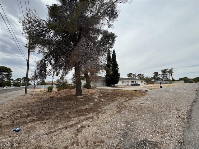 2583 Emerald Ave, Las Vegas, NV 89120 - view of yard with a garage