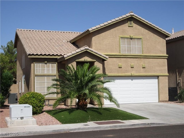 10013 Solid Lime St, Las Vegas, NV 89183 - view of front facade with a tile roof, concrete driveway, stucco siding, and a garage