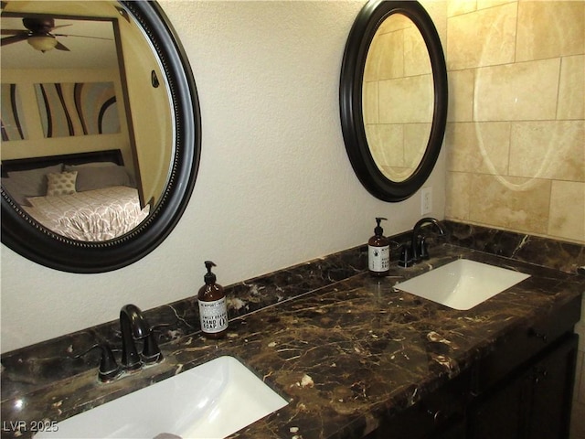 10013 Solid Lime St, Las Vegas, NV 89183 - bathroom featuring a ceiling fan and double vanity