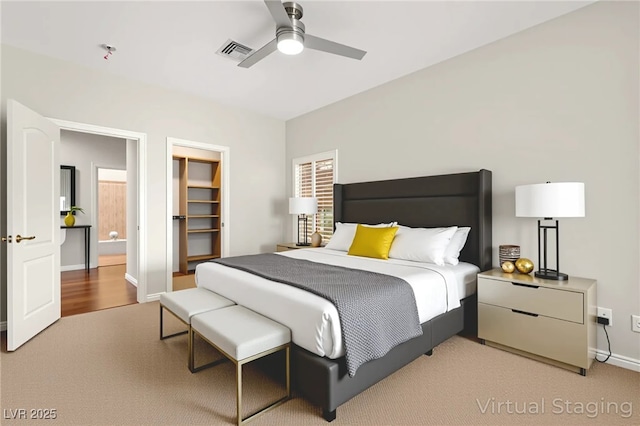 1800 Aztec Cliffs Ct, Las Vegas, NV 89128 - bedroom featuring carpet flooring, a spacious closet, and a ceiling fan