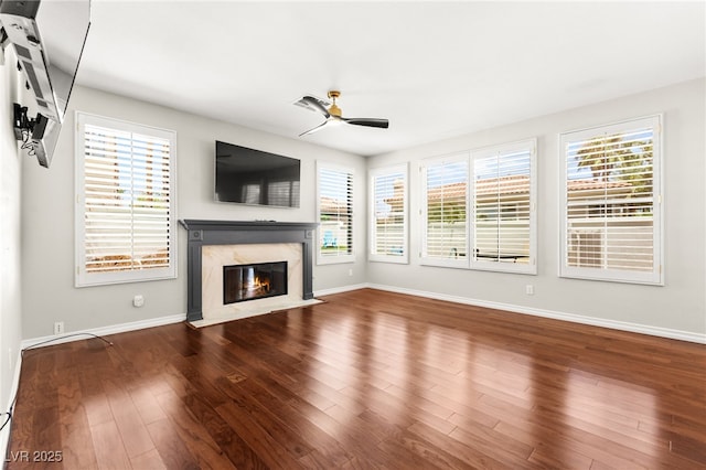 1800 Aztec Cliffs Ct, Las Vegas, NV 89128 - unfurnished living room with a premium fireplace, a ceiling fan, and wood finished floors