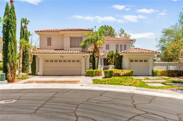 1800 Aztec Cliffs Ct, Las Vegas, NV 89128 - mediterranean / spanish-style house featuring stucco siding, a tile roof, driveway, and a chimney