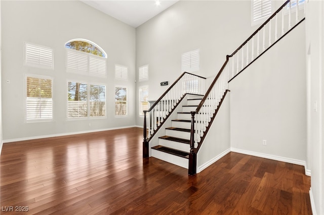 1800 Aztec Cliffs Ct, Las Vegas, NV 89128 - staircase featuring a high ceiling and wood finished floors