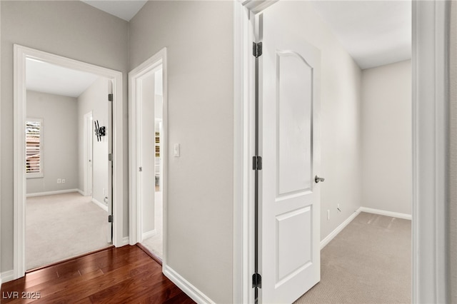 1800 Aztec Cliffs Ct, Las Vegas, NV 89128 - hallway featuring dark wood-style floors and dark colored carpet